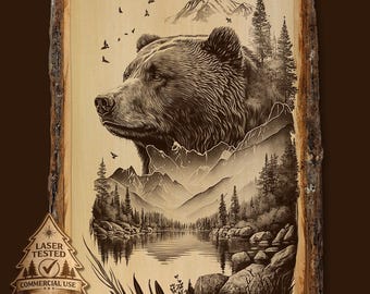 May include: A rectangular wood plaque with natural bark edges featuring a laser-engraved scene of a bear head layered over a mountain range, pine forest, and lake. A small tree-shaped emblem reads LASER TESTED COMMERCIAL USE.