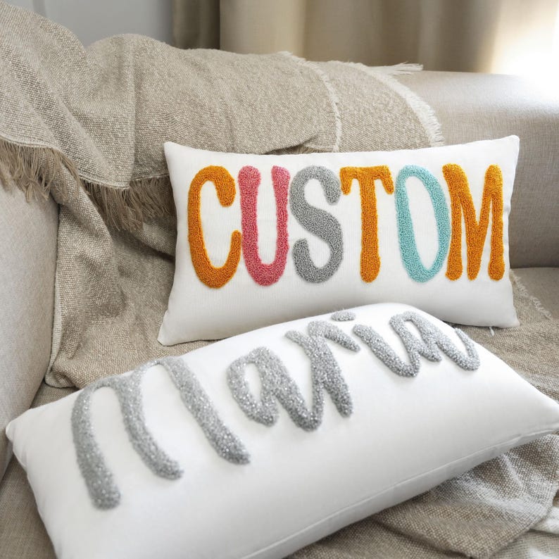 a white pillow with the word custom on it