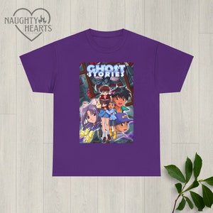 May include: Purple t-shirt with a graphic print of the anime Ghost Stories. The graphic features a group of characters from the show, including a girl with purple hair and a boy with brown hair.