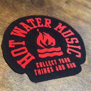 May include: A black and red circular patch with the text "Hot Water Music" in a circle around a red flame and water wave design. The text "Collect Your Things And Run" is printed below the design.