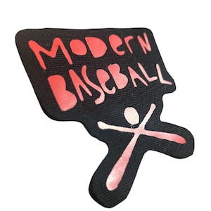 May include: Black and red embroidered patch with the text "MODERN BASEBALL" and a stick figure holding a baseball bat.