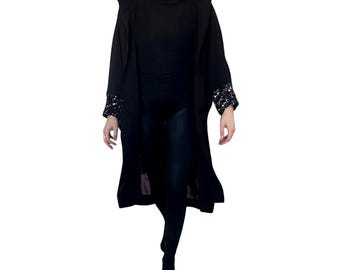 Kimono transparente con capucha y puños de lentejuelas brillantes. Negro. Tallas S-L para festival.