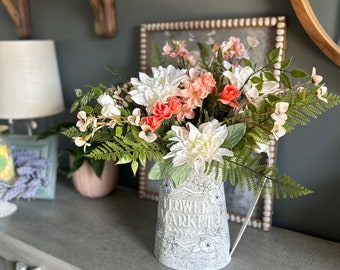 Rustic watering can floral centerpiece