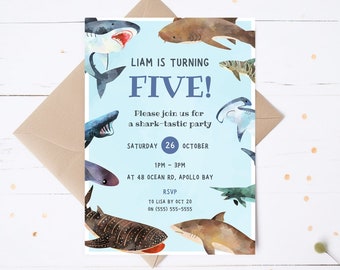 May include: A blue and white birthday invitation with a shark theme. The invitation says "Liam is turning Five!" and includes details about the party, including the date, time, and location. The invitation is decorated with colorful illustrations of sharks.