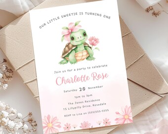 May include: A pink and green birthday invitation with a watercolor illustration of a turtle wearing a pink flower. The invitation says "Our little sweetie is turning one" and includes the name "Charlotte Rose", the date "Saturday 20 November", the time "1pm to 3pm", the location "The Jones Residence, 15 Lillypilly Drive, Rosedale", and the RSVP information "RSVP to Lisa on (555)555-5555".