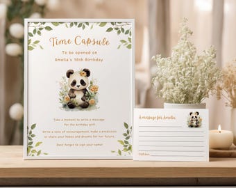 Könnte beinhalten: Ein weißer Rahmen mit einer Illustration eines grünen und braunen Pandabären. Der Rahmen trägt den Text "Time Capsule" und "To be opened on Amelia's 18th Birthday". Eine weiße Karte mit dem Text "A message for Amelia" befindet sich unter dem Rahmen.