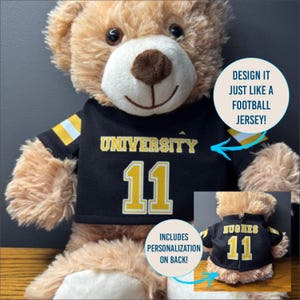 May include: A plush teddy bear wearing a black and gold football jersey. The jersey has the word "UNIVERSITY" and the number "11" in gold lettering. The jersey also has gold and white stripes on the sleeves. The back of the jersey can be personalized.