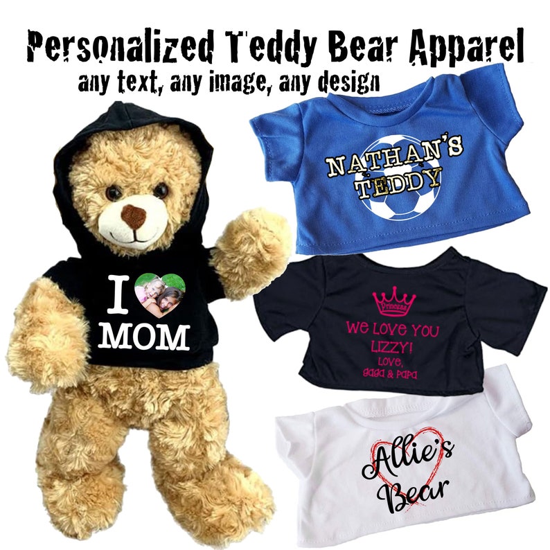 May include: Four personalized teddy bear shirts. The first shirt is black with a white heart and the text "I MOM". The second shirt is blue with the text "NATHAN'S TEDDY" and a soccer ball. The third shirt is black with a crown and the text "We love you Lizzy! Love, Gaga & Papa". The fourth shirt is white with a red heart and the text "Allie's Bear".