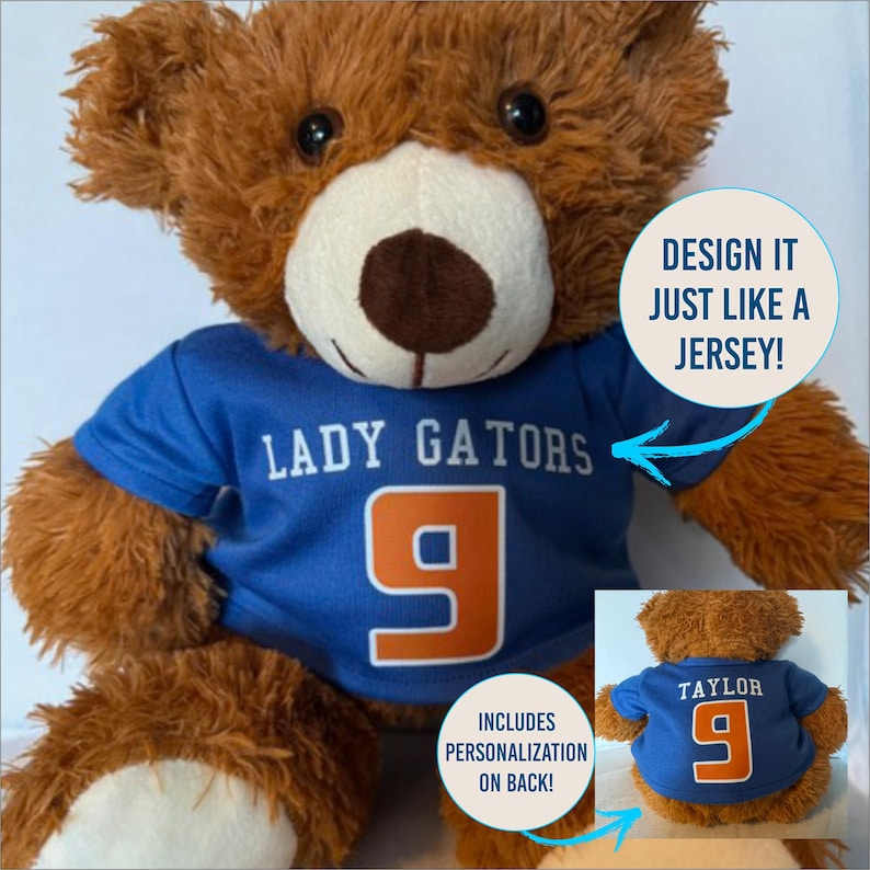 May include: A brown teddy bear wearing a blue jersey with the words "LADY GATORS" and the number 9 in orange. The jersey design is customizable. The back of the jersey can be personalized. The text "DESIGN IT JUST LIKE A JERSEY!" is also visible.