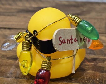 Christmas Yellow Rubber duck, Holiday duck, wrapped w/lights,with a sign that says Santa help. Gift for the duck lover or jeep owner .