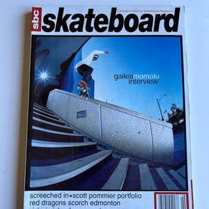 May include: A magazine cover featuring the word "skateboard" in large, bold letters. The cover has a photo of a skateboarder performing a trick. Text includes "gailea momolu interview" and "screeched in scott pommier portfolio".