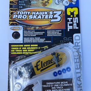 May include: A Tech Deck Tony Hawk's Pro Skater 3 finger skateboard in its original packaging. The yellow Element branded board features black trucks, four blue spare wheels, and a black T-shaped tool. The card displays graphics and text.