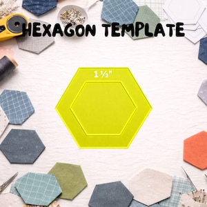 May include: A bright yellow hexagon template with the text "1 1/2"" printed on it. The template is surrounded by fabric hexagons in various colors and patterns, along with sewing tools. The words "HEXAGON TEMPLATE" are printed at the top.