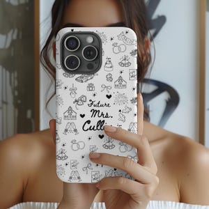 May include: White phone case with a black and white wedding-themed design. The case features illustrations of wedding bells, rings, a church, a cake, and the text "Future Mrs. Culli."