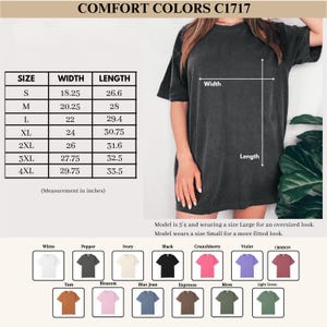 May include: A dark gray Comfort Colors C1717 t-shirt. The image includes a size chart with measurements in inches, ranging from Small to 4XL. Color options include white, black, and various other shades. The model is 5'4" and wearing a size Large for an oversized look.