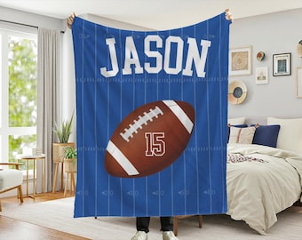 May include: Blue fleece blanket with a football and the name "JASON" printed on it. The blanket has a football field design.