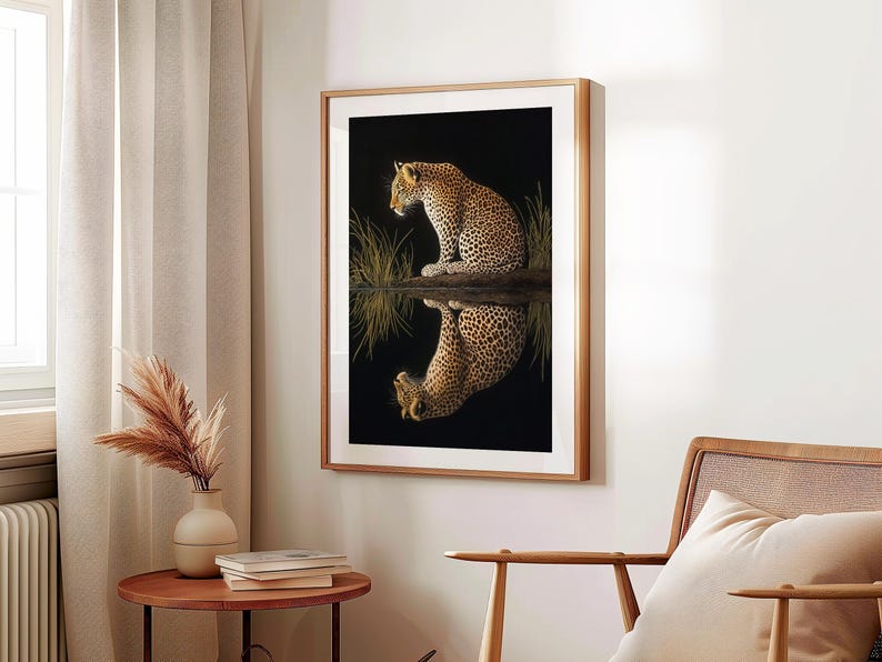 May include: A framed print of a leopard sitting in a body of water, looking to the left. The leopard's reflection is visible in the water.