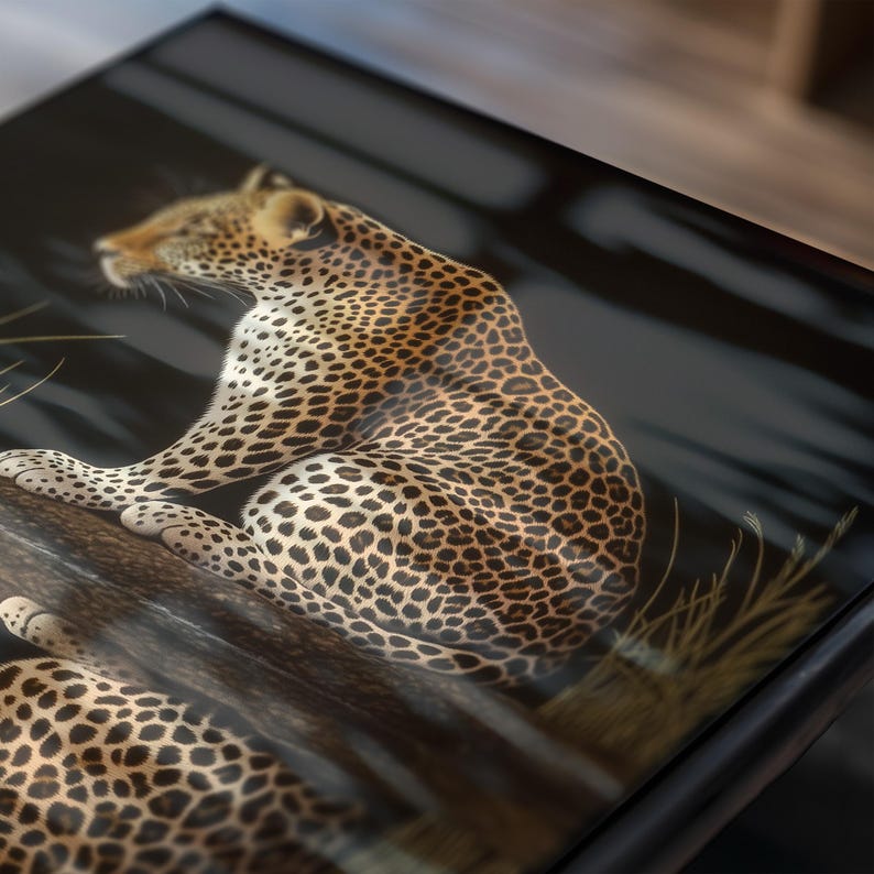 May include: A close-up of a leopard with black spots on a brown background. The leopard is sitting on a branch with its head turned to the side. The image is framed in a black frame.