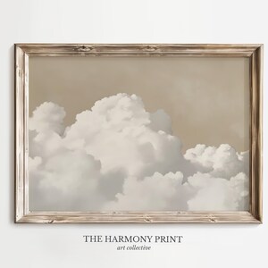 May include: A framed print of a beige and white cloudy sky. The print is titled "The Harmony Print" and is by the art collective.
