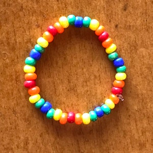 Rainbow Beaded Ring, glass seed beads. Thin dainty beaded stretchy ring.Rainbow lucky nature inspired jewelry