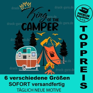 May include: A teal and orange camper van with a tent and a campfire in front of it. The text "King of the Camper" is above the camper. The text "TOPPREIS" is on the right side of the image. The text "6 verschiedene Größen SOFORT versandfertig TÄGLICH NEUE MOTIVE" is at the bottom of the image.
