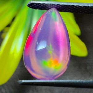 AAA Grade Natural Radiant purple opal gemstone with neon fire play, pear cabochon for custom jewelry design or vibrant Loose Opal.