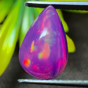 AAA Grade Natural Radiant purple opal gemstone with neon fire play, pear cabochon for custom jewelry design or vibrant Loose Opal.