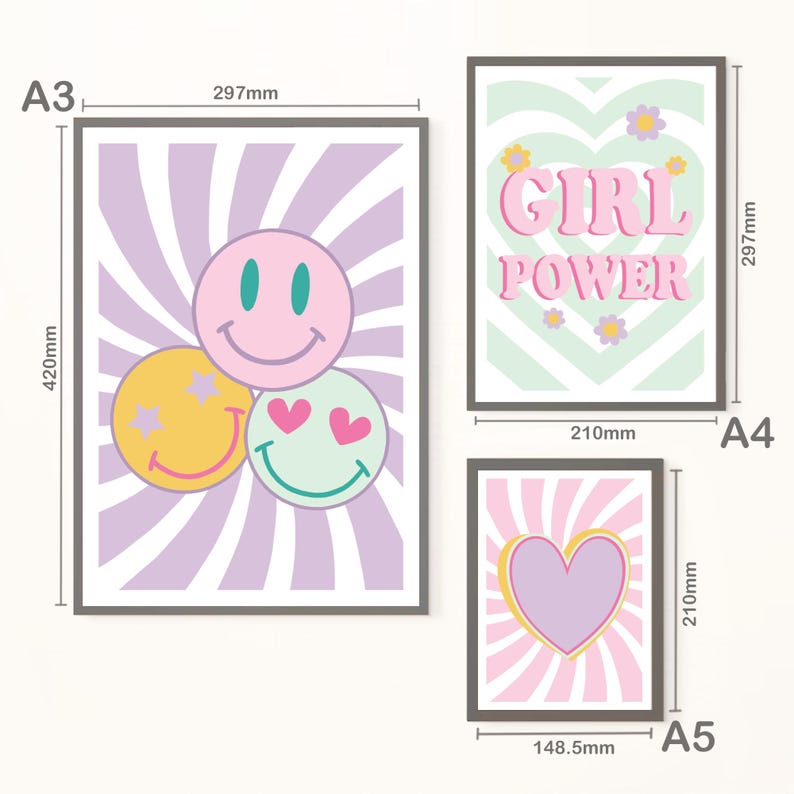 May include: Three framed art prints with a retro theme. One print features three smiley faces, another says "GIRL POWER", and the third has a heart. The prints measure 420mm x 297mm, 297mm x 210mm, and 210mm x 148.5mm.