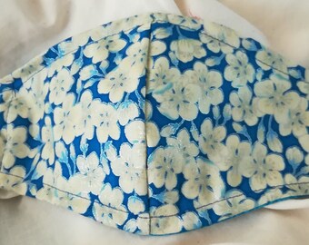 White Cherry Flowers on Blue. Asian Inspired .Fits most adults.cotton. soft poli ear holder. Made in Oregon, washable. reusable