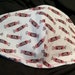 Tootsie Rolls. Face Mask .Fits most adults.cotton. poli fabric soft ear holder. Made in Oregon, washable. reusable