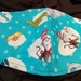 XL SIZED Dr. Seuss Blue . Face Mask .Fits most adults.cotton. poli fabric soft ear holder. Made in Oregon, washable. reusable