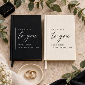 May include: Two hardcover journals, one black and one off-white, featuring the text "PROMISES to you" with "FROM JAMES" or "FROM EMILY" and the date "20 SEPTEMBER 2026" printed on the front covers, accompanied by two gold-toned metal rings.
