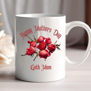 May include: White ceramic mug with a red design that says "Happy Mothers Day Goth Mom" and features a bouquet of dried red roses.