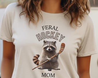 Feral Hockey Mom Unisex Softstyle T-Shirt, Cute Raccoon Hockey Tee, Funny Sports Fan Shirt, Gift for Mom, Retro Hockey Mom Shirt,