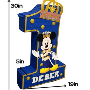 May include: Blue and gold Mickey Mouse themed number one piñata with a crown on top. The piñata is 30 inches tall and 19 inches wide. The name Derek is written on the bottom of the piñata.
