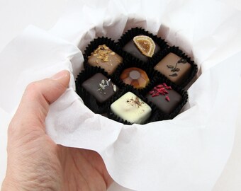 Handmade delicate porcelain bowl filled with delicious Belgian chocolates