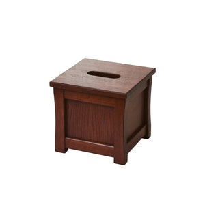 May include: A dark brown wooden tissue box cover with a rectangular opening on the top.