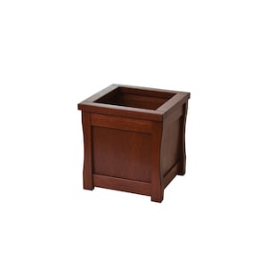 May include: A dark brown wooden planter with a square shape and slightly rounded edges. The planter has a smooth, finished surface.