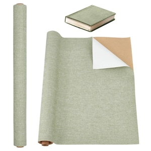 May include: A roll of light green textured wallpaper, a partially unrolled sheet, and a small book with a matching cover. The wallpaper has a woven appearance and is shown rolled up, unrolled, and with a corner peeled back to reveal a white backing.