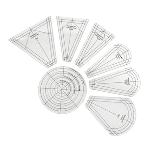 May include: A set of nine white plastic templates for crafting, including a circle template with concentric circles and eight petal templates of varying sizes. The templates are labeled with numbers and descriptions, such as "Template #3 12 Pointy Petal Plate".