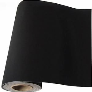 May include: A roll of solid black adhesive contact paper featuring a smooth, matte finish. The material is wound tightly around a central cardboard core, showing a consistent dark color throughout the entire surface of the flexible sheet.
