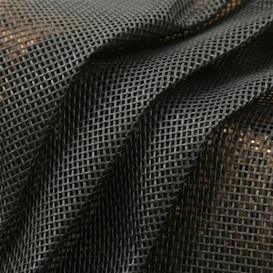 May include: Close-up of black mesh fabric with a woven pattern. The fabric is draped in soft folds, creating shadows and highlights. The texture of the material is visible, with a grid-like structure.