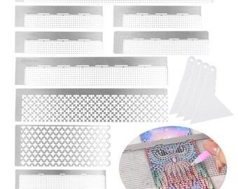 May include: Set of nine stainless steel diamond painting rulers with different grid patterns and three plastic diamond painting tools. The rulers are used to help align diamonds while painting.