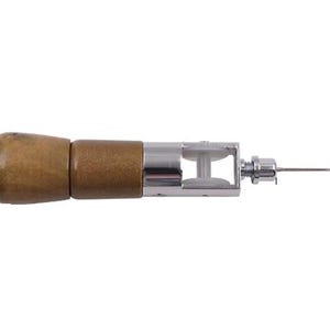 May include: A wooden handled leather sewing awl with a metal needle and a small metal wheel.