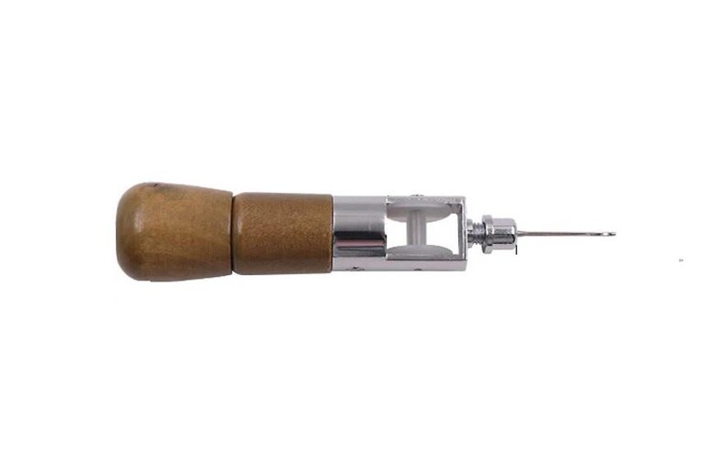 May include: A wooden handled leather sewing awl with a metal needle and a small metal wheel.