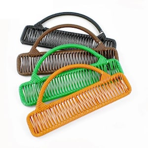 May include: Four colorful woven rattan handbags in black, brown, green, and orange. Each bag has a curved handle and a rectangular body with vertical woven slats. The bags are arranged diagonally against a white background.