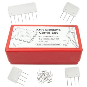 May include: A red plastic box with a white label that says "Knit Blocking Comb Set" and lists the contents: 15 blockers with 8 pins, 10 blockers with 4 pins, and 100 T-pins. The box contains a set of knitting tools, including blocking combs, T-pins, and a crochet hook. The label also says "Rust Free Stainless Steel".