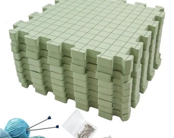 May include: A stack of 10 green foam floor tiles with a grid pattern. The tiles are designed for use as a crafting surface. The image also shows a bowl of yarn, knitting needles, and a container of pins.