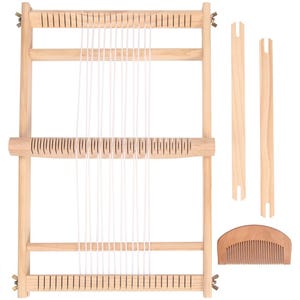 May include: A light-coloured wooden weaving loom with white warp threads. The loom has two wooden shuttles and a wooden comb. The frame is made of light-coloured wood, ideal for textile crafts.