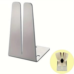 May include: A silver-colored metal zipper foot attachment featuring a vertical slot design for guiding fabric. The L-shaped tool includes two circular mounting holes on the base. A small circular inset shows the metal guide holding a beige zipper tape.